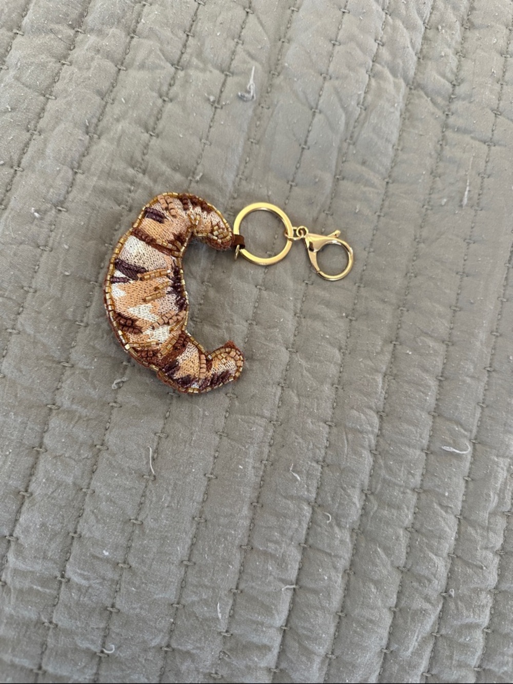 Anthropologie Embroidered Croissant Bag Charm - Gold & Brown